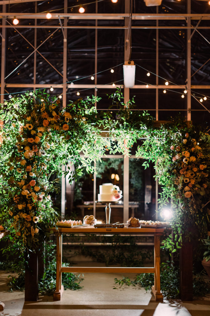Dessert display with floral arbor