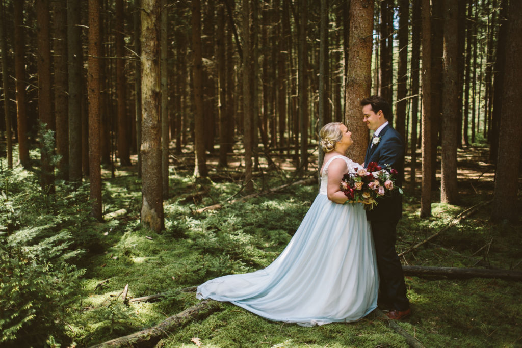 Bride and groom woodland portrait