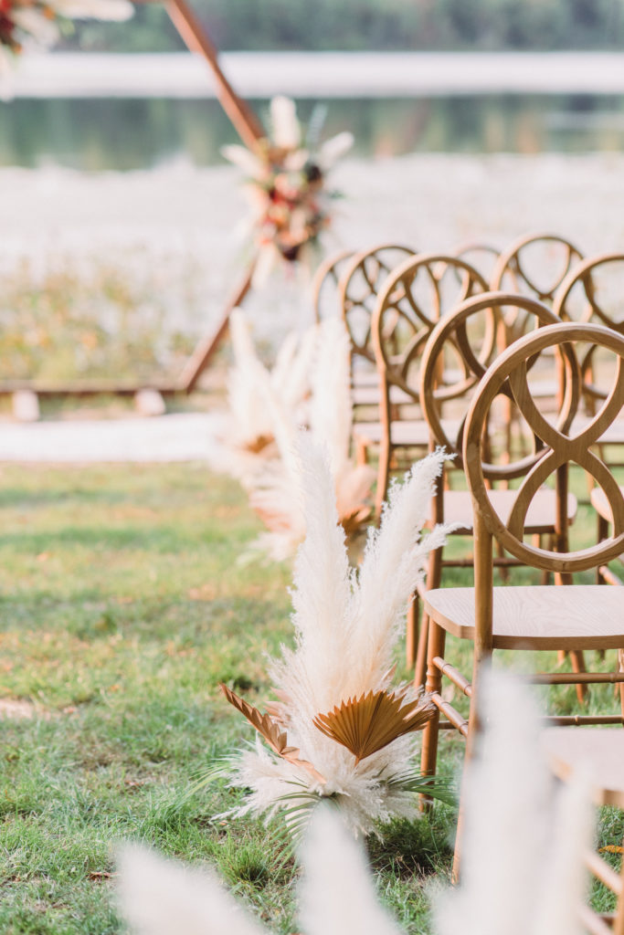 Ceremony aisle lined with pampas grass